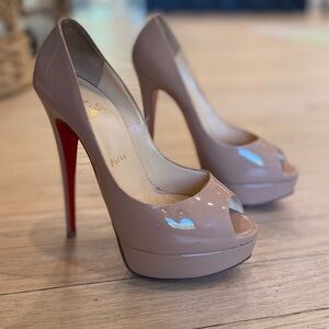 Christian Louboutins - Nude Patent Leather heel. Worn 2x. Size 38.5 (8.5 in US)